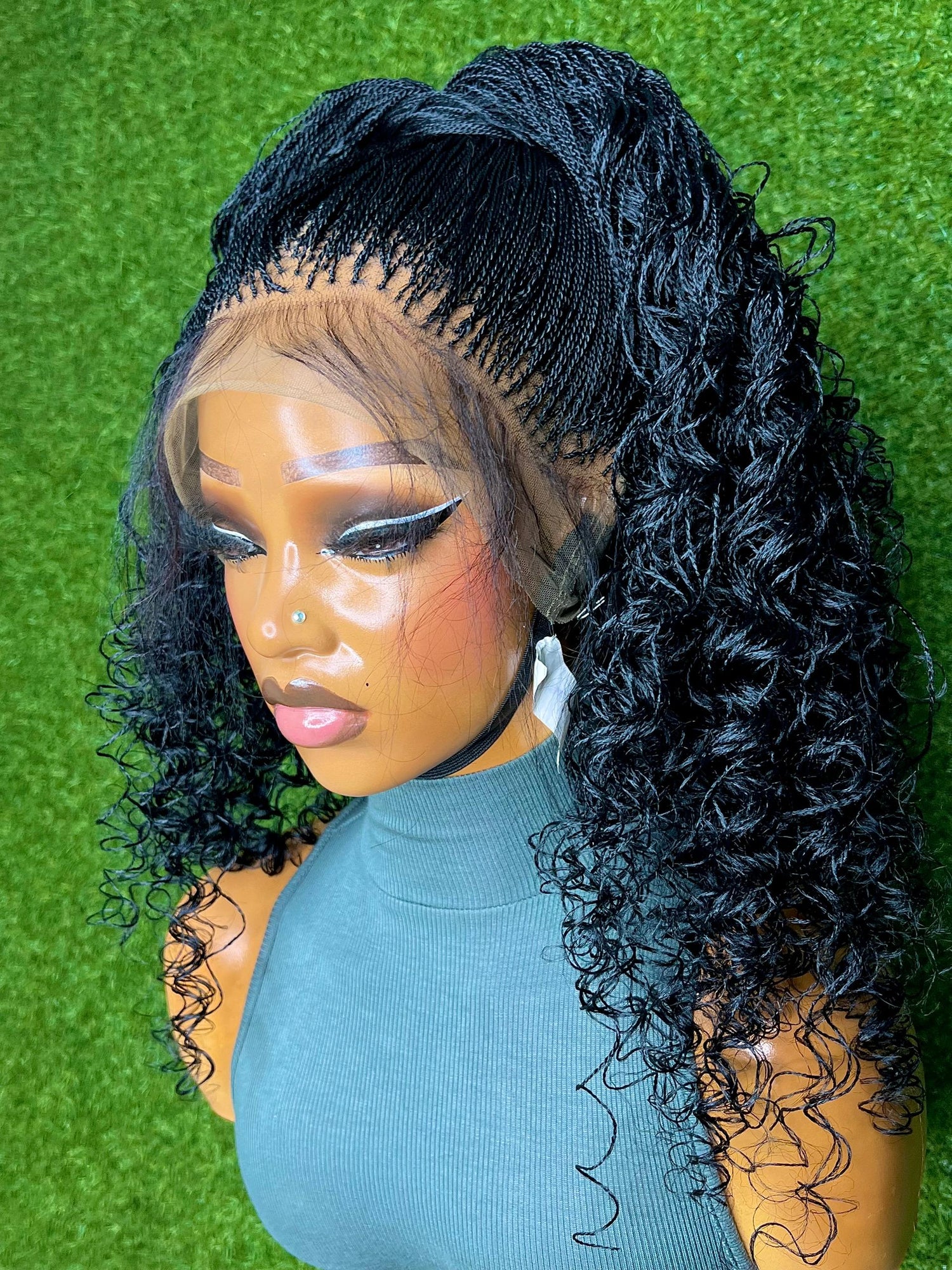 Extra Micro Twist Deep Wave Curls luxury braided wig with soft and voluminous curls on a mannequin display.
