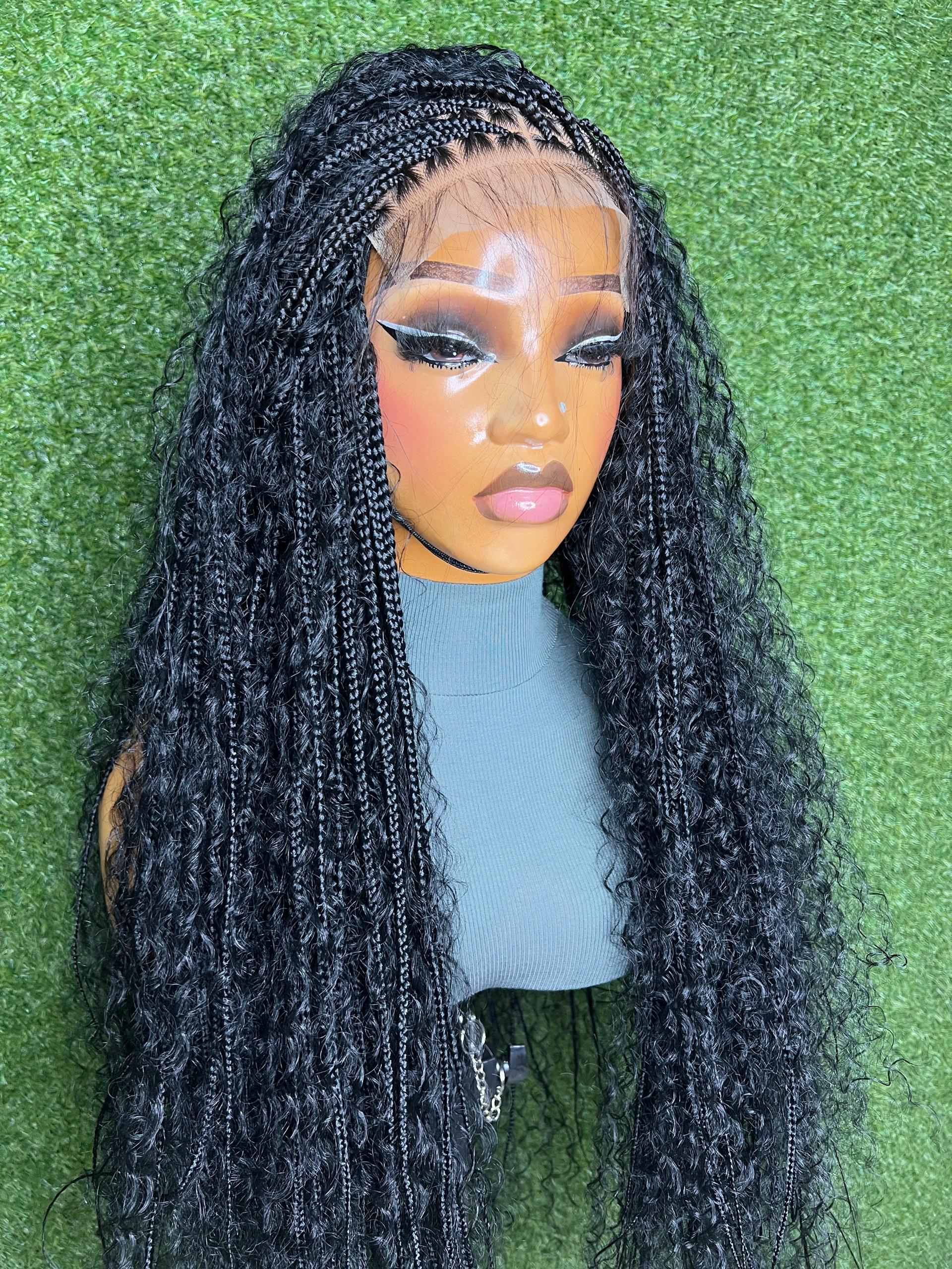 Wig B Closure Glueless Synthetic Curl Wig displayed on a mannequin with black curls against a green background.
